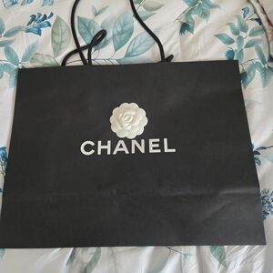 CHANEL Black Bag with White Camellia
